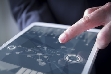finger touches digital tablet business