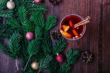 Mulled wine with cinnamin and orange on christmas decoration. Top view
