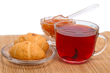 Red tea and croissant