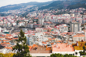 Aerial view on Vigo in Spain. Crowded blocks, offices, roads, hi