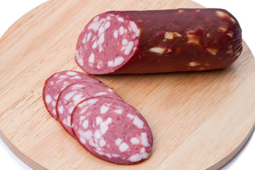 Smoked sausage on a kitchen board