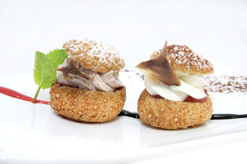 Profiteroles with vanilla ice cream decorated with chocolate mint