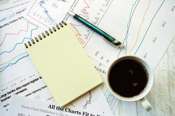 Workplace in office, coffee and notebook