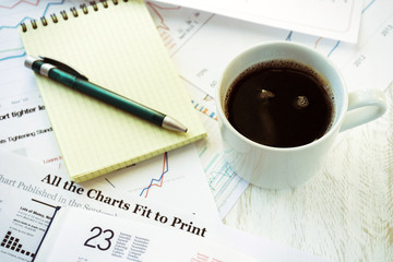 Workplace in office, coffee and notebook