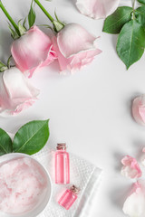 organic cosmetic with rose oil on white background top view