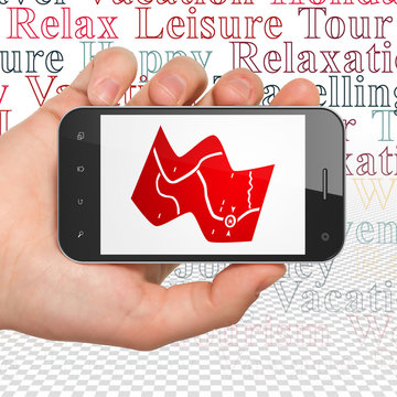 Travel concept: Hand Holding Smartphone with Map on display