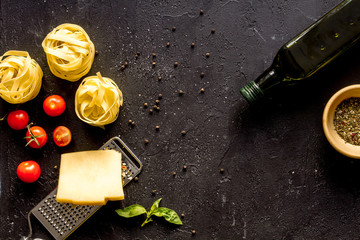 ingredients for cooking paste on dark background top view