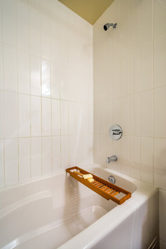 Luxury bathroom with wood bathroom caddy.