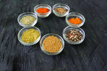Various spices and herbs on white background.