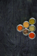Various spices and herbs on white background.