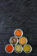 Various spices and herbs on white background.