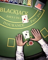 poker player at blackjack table in online casino