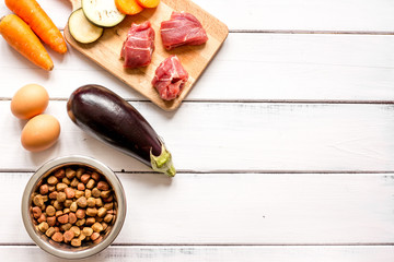 ingredients for pet food holistic top view on wooden background