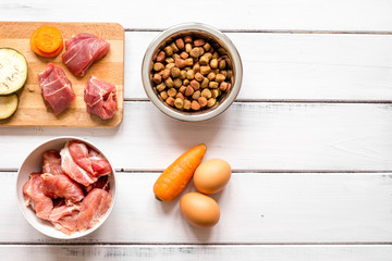 ingredients for pet food holistic top view on wooden background