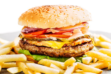 homemade hamburger with beef, onion, tomato, lettuce and cheese.