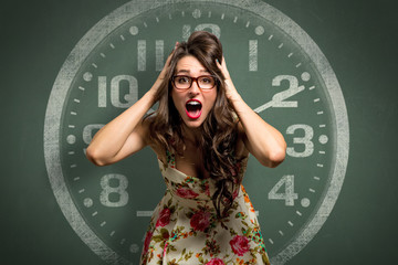 Woman freaking out in extreme anxiety panic attack, late, out of time, clock