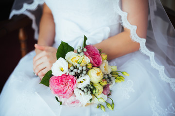 bridal bouquet in hands of the bride
