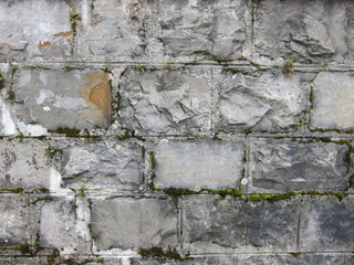 Stone Rectangular Blocks and Mortar Grey Wall Face Old European Surfce