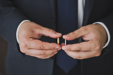 A man holding wedding ring in hand 6738.