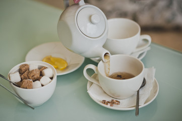 The girl pours a Cup of tea 6743.
