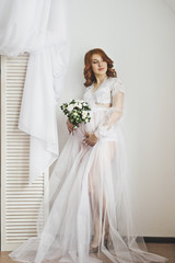 Fototapeta premium Portrait of a redhead pregnant girl in full growth 6844.