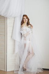 Fototapeta premium Gentle pregnancy in white robes 6854.