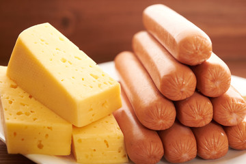 sausage and cheese on a white plate