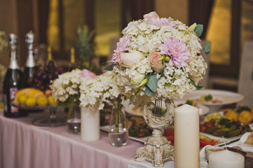 The food table is decorated with flowers 7066.