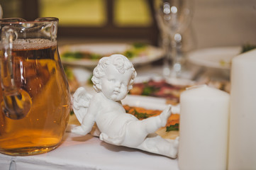 Angel figurine on the table 7068.