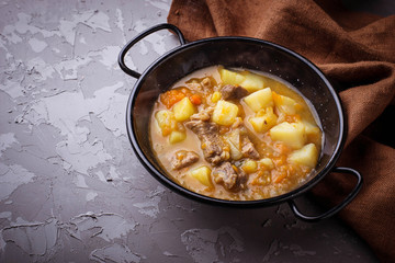 Stewed beef with potatoes, carrot and pumpkin