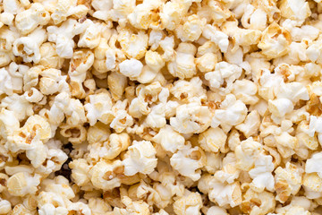 Popcorn background. Caramel sweet corn. Cinema snack.