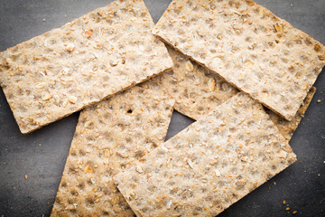 Stack of wholegrain crispy bread with sunflower, chia and sesame