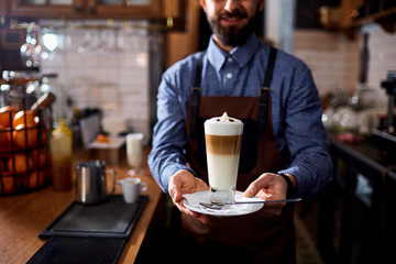 Barman barista uniform making coffee tea cocktails in the bar, restaurant, shop.