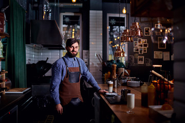 Barman barista uniform making coffee tea cocktails in the bar, restaurant, shop.