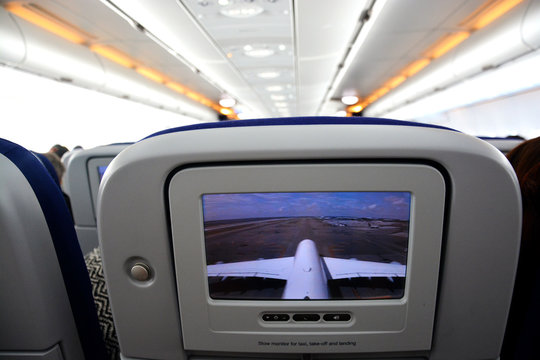 Interior of commercial aircraft- close-up of LCD rear seat showing live images from outside the plane