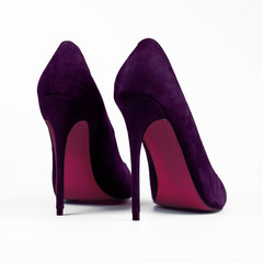 female purple shoes over white