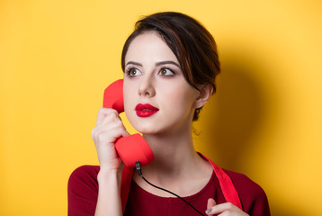 young housewife with red handset