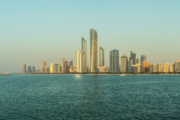 Fototapeta na wymiar Abu Dhabi Skyline at sunset, United Arab Emirates