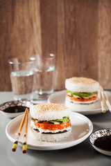 sushi like burger made from rice and smoked salmon, avocado, lig