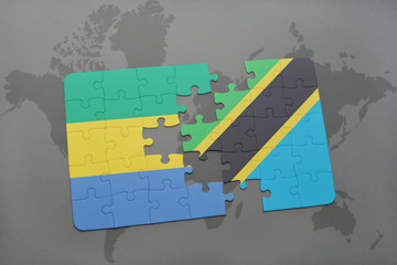 puzzle with the national flag of gabon and tanzania on a world map