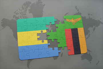 puzzle with the national flag of gabon and zambia on a world map