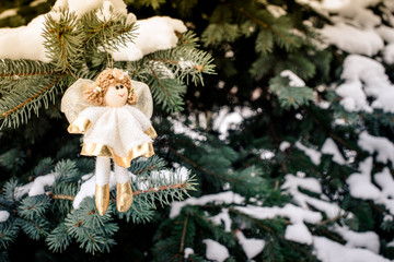 Christmas background Silver Angel in the branches of fir 