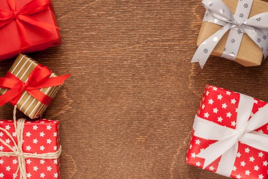 different gifts on wooden background