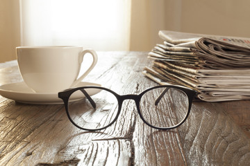newspaper over wooden table