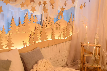 Christmas bedroom interior with Christmas trees, stars, deers, lights with bokeh