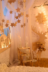 Christmas bedroom interior with Christmas trees, stars, deers, lights with bokeh