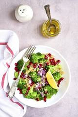 Quinoa salad with broccoli,red onion and pomegranate.Top view.