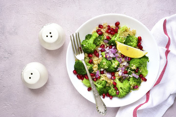 Quinoa salad with broccoli,red onion and pomegranate.Top view.