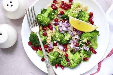 Quinoa salad with broccoli,red onion and pomegranate.Top view.
