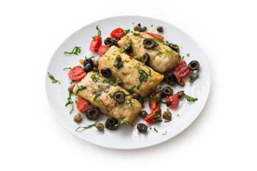 Filetti di merluzzo alla mediterranea, boiled cod fillets with black olives, capers and tomatoes